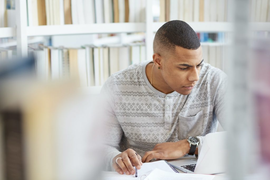 University student working in library